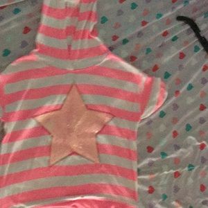 A shirt that has a hood and a star